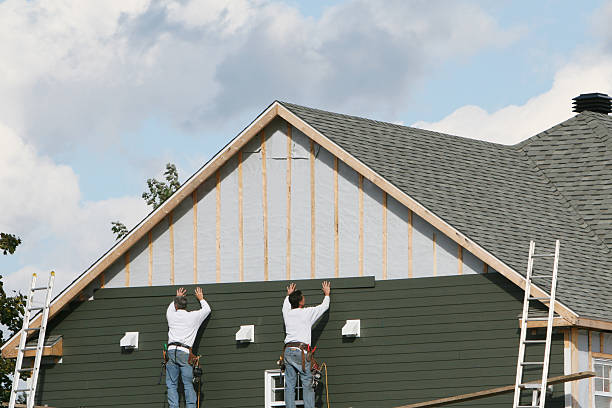 Professional Siding Replacement technician working in Spencerville, MD